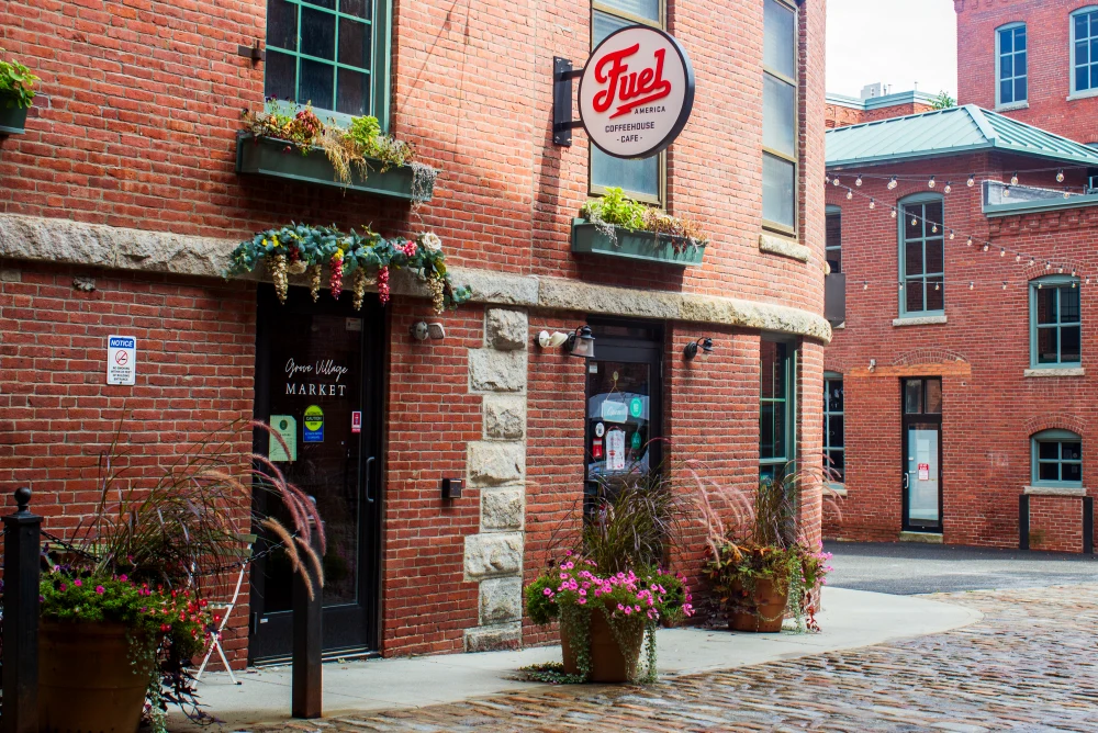 Fuel America Grove Street courtyard with brick buildings and café sign