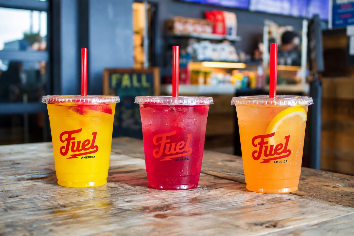 Three colorful Fuel Up drinks in branded Fuel America cups.