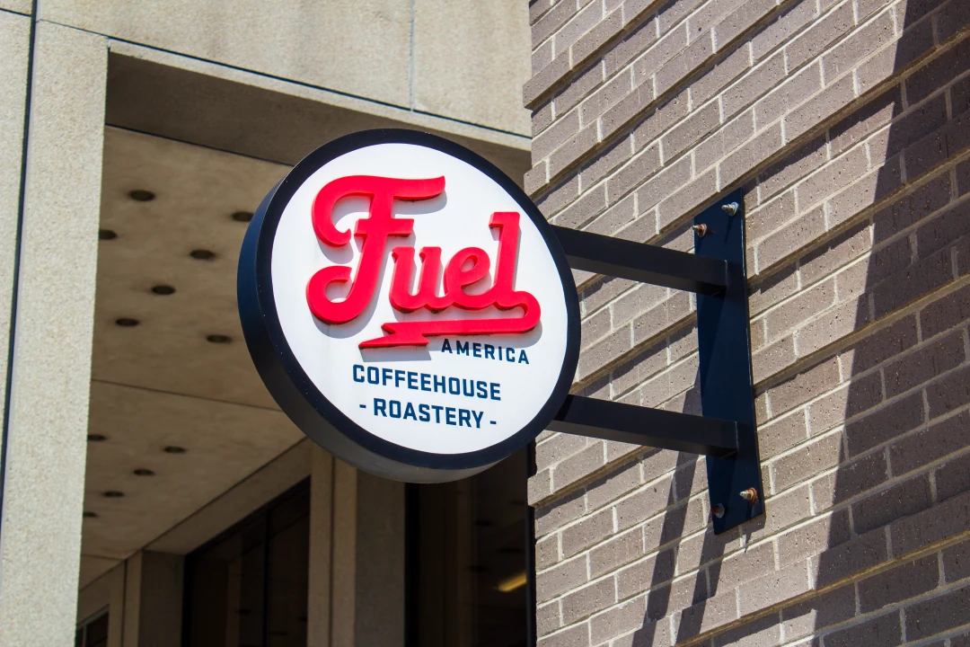 Round Fuel America sign outside the Worcester Mercantile café