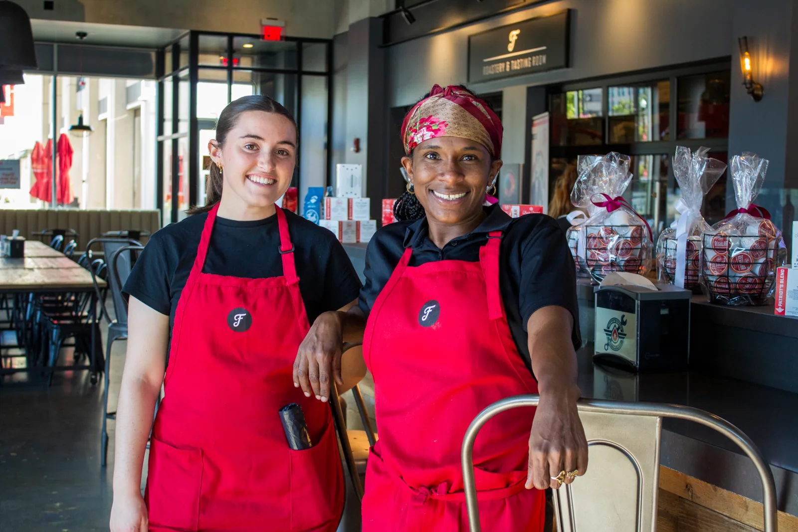Two Fuel America team members welcoming guests at the café